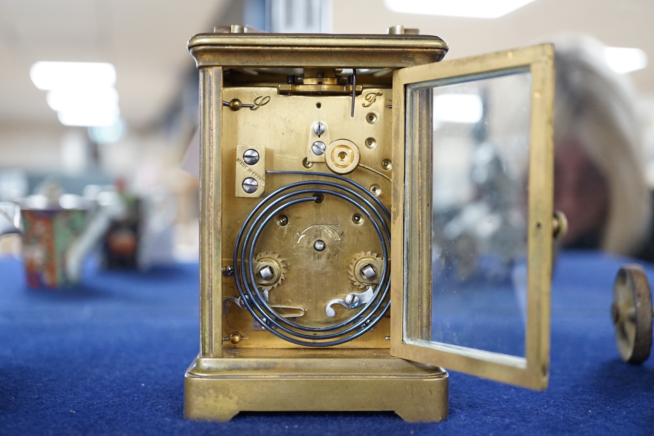 A striking carriage clock, 12cm tall